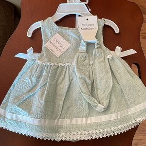 Mint green baby dress. Size: 3-6 months. Never worn, tickets on.